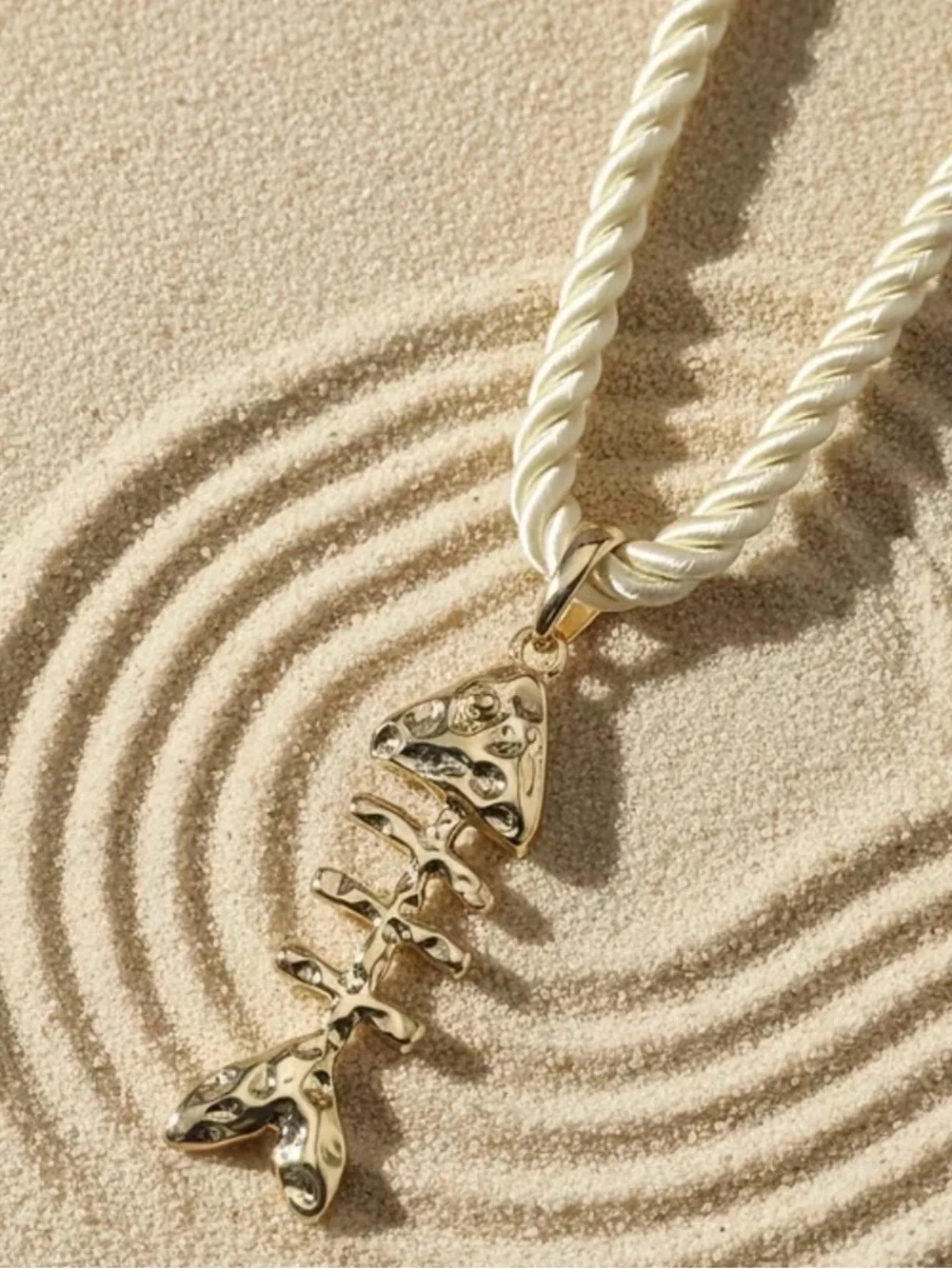 Gold Fishbone Pendant Necklace on Cream Rope Chain